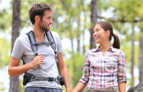 A couple on a hike in the woods