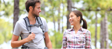 A couple on a hike in the woods